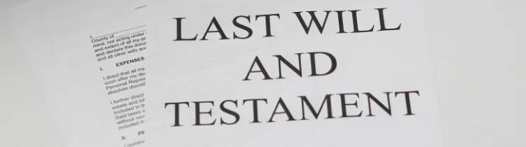 A printed last will and testament document photographed close up on a desk.